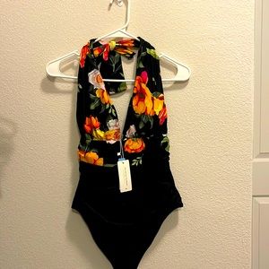 New with tags a one piece multi color swim suit.